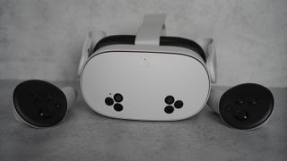 Meta Quest 3S with controllers on a grey background