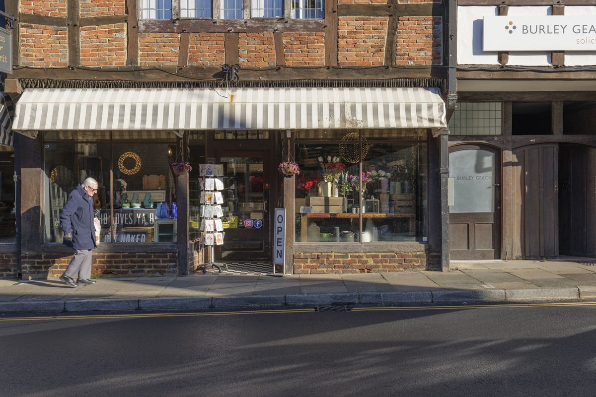 Picture taken with Panasonic S5 II of British high street shop front in bright light with HDR edit