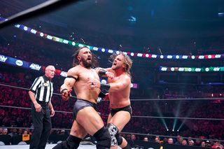 PAC (l.) battles "Hangman" Adam Page during the premiere episode of ‘AEW: Dynamite.‘