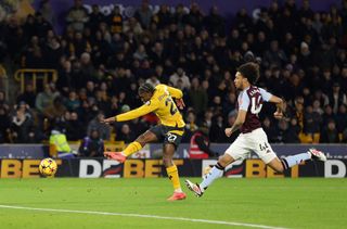 Jean-Ricner Bellegarde of Wolverhampton Wanderers scores his team's first goal during the Premier League match between Wolverhampton Wanderers FC and Aston Villa FC at Molineux on February 01, 2025 in Wolverhampton, England