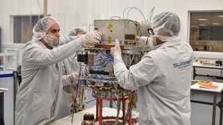 Technicians integrate NASA's Deep Space Atomic Clock into its Orbital Test Bed Earth-orbiting satellite, which will launch on the STP-2 mission on a SpaceX Falcon Heavy rocket in June 2019.