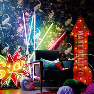 neon light sticks with patterned wallpaper and chair