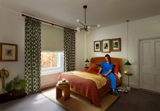 Kendra Sage Electric Blackout Roman blind and Loxley Emerald curtains with Mineral coloured lining