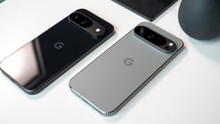 An Obsidian Google Pixel 9 next to a Hazel Google Pixel 9 Pro