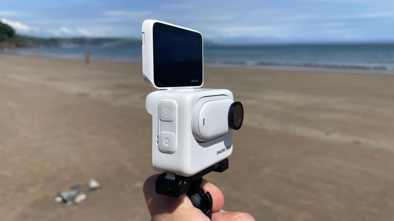 Insta360 GO 3 action camera on a beach