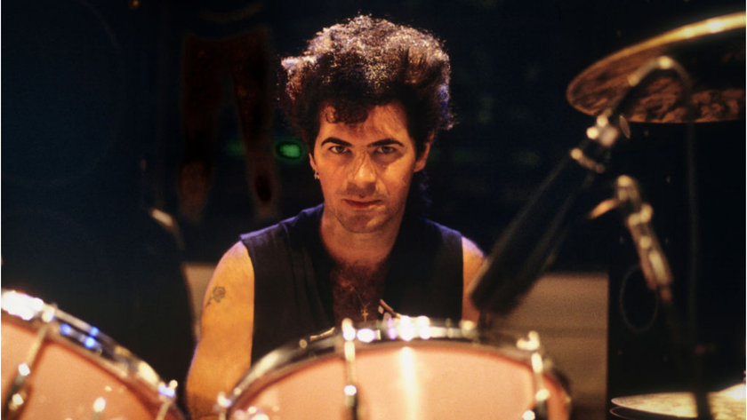 Portrait of American Rock musician Thommy Price as he sits behind his drum kit, Washington DC, 1981.