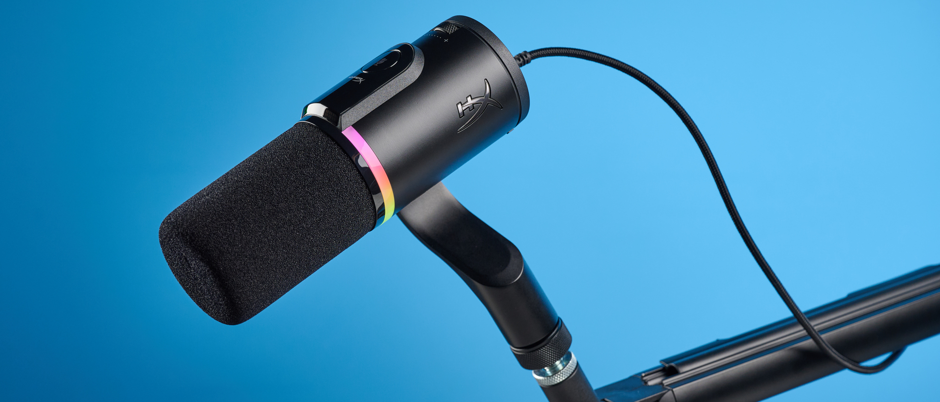 the hyperx flipcast streaming microphone on a boom arm with an RGB LED panel and an xlr and usb-c connectivity