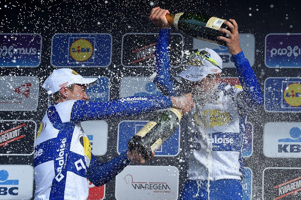 The Topsport Vlaanderen-Baloise riders celebrate with a champagne shower.