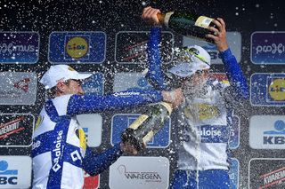 The Topsport Vlaanderen-Baloise riders celebrate with a champagne shower.