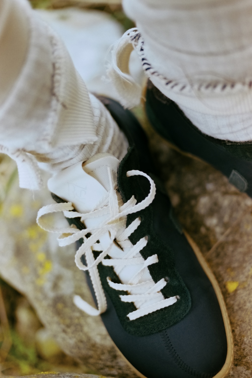 a close-up of veja x baserange sneakers