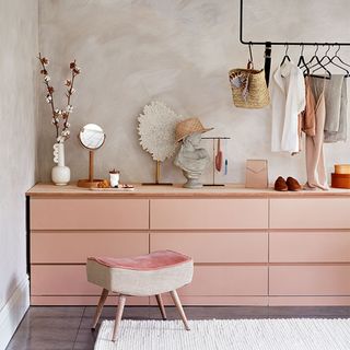 Pink painted chest of drawers dressing area