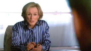 Glenn Close speaks with a client at her conference table in Damages.
