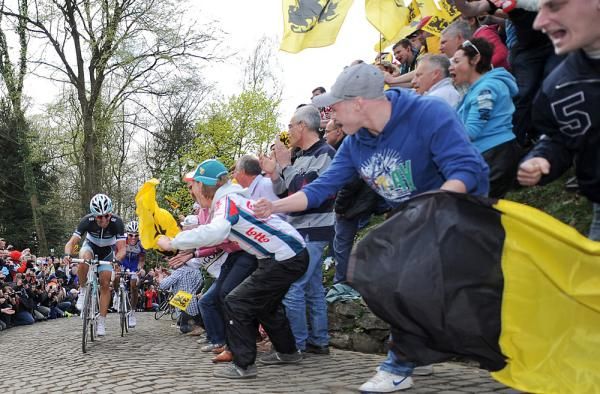 The Belgian fans go crazy for two non-Belgians battling up the Kapelmuur