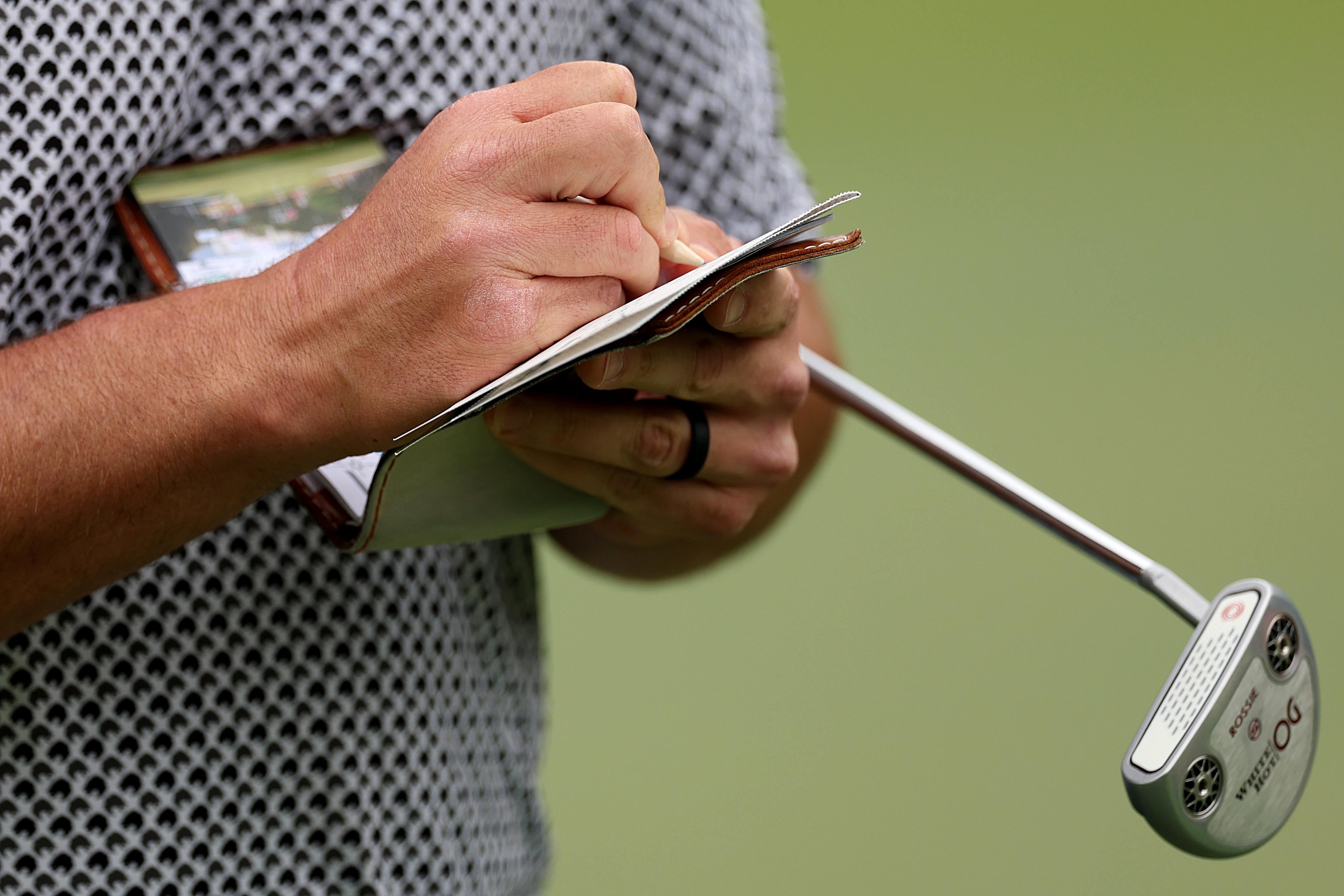 A close-up of Jon Rahm's putter