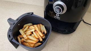 Magic Bullet Air Fryer with tray removed to show browned fries