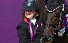 LONDON, ENGLAND - SEPTEMBER 03: Natasha Baker of Great Britain with Cabral wins gold in the Dressage Individual Freestyle Test, Grade II in the Equestrain on day 5 of the London 2012 Paralympic Games at Greenwich Park on September 3, 2012 in London, England. (Photo by Julian Finney/Getty Images)