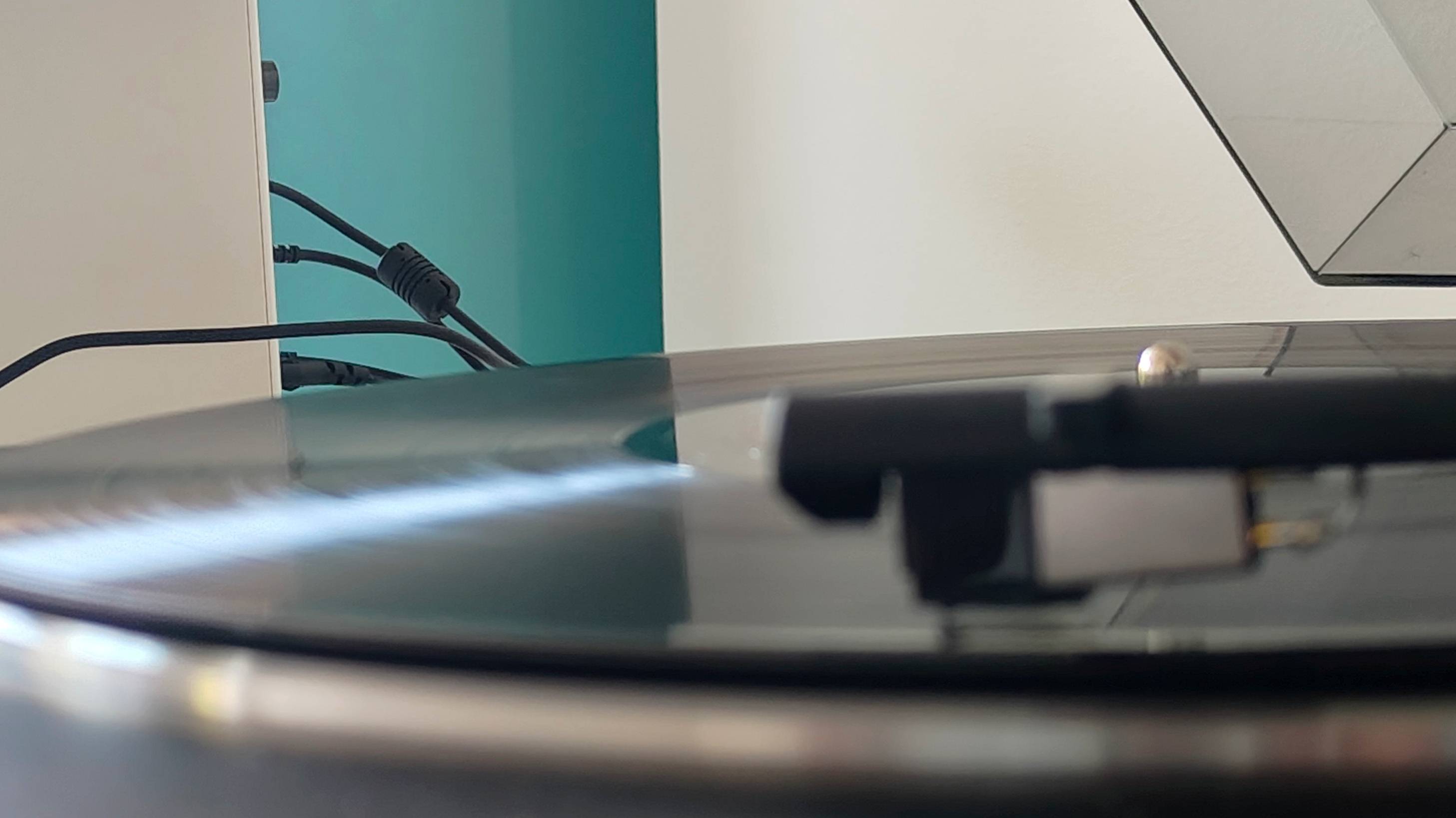 The Sony PS-LX310BT and Edifier M90 on a shelf.