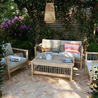 herringbone brick patio with garden furniture in outdoor seating area