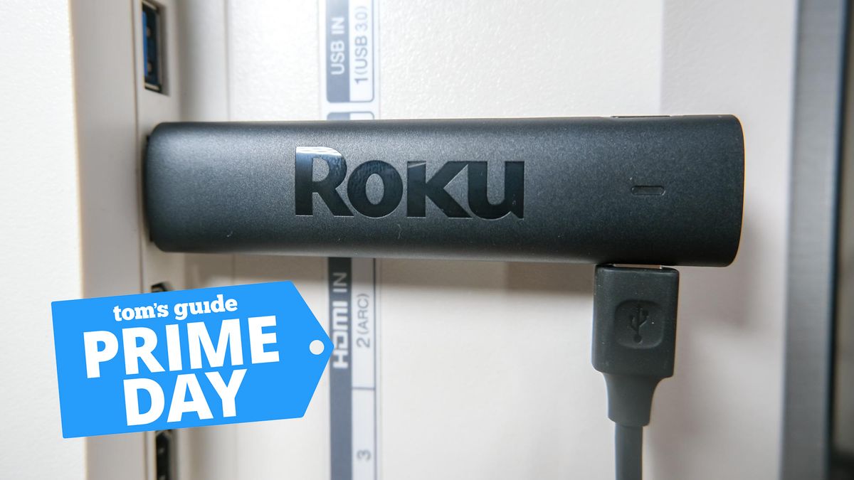 Roku Streaming Stick 4K (2021) plugged into a TV, with a Tom&#039;s Guide Prime Day sticker in the corner of the image