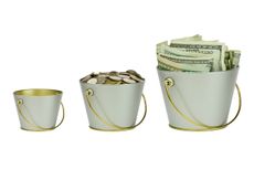 Three buckets with money, different sizes