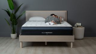Helix Midnight Luxe mattress with our sleep editor lying on it