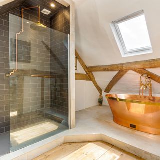 atic bathroom with copper bathtub with shower room