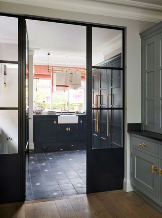 a laundry room behind a crittall divider