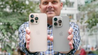 iPhone 16 Pro vs iPhone 16 Pro Max in hand showing back of phones