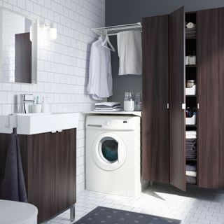 Laundry area in a modern wooden bathroom