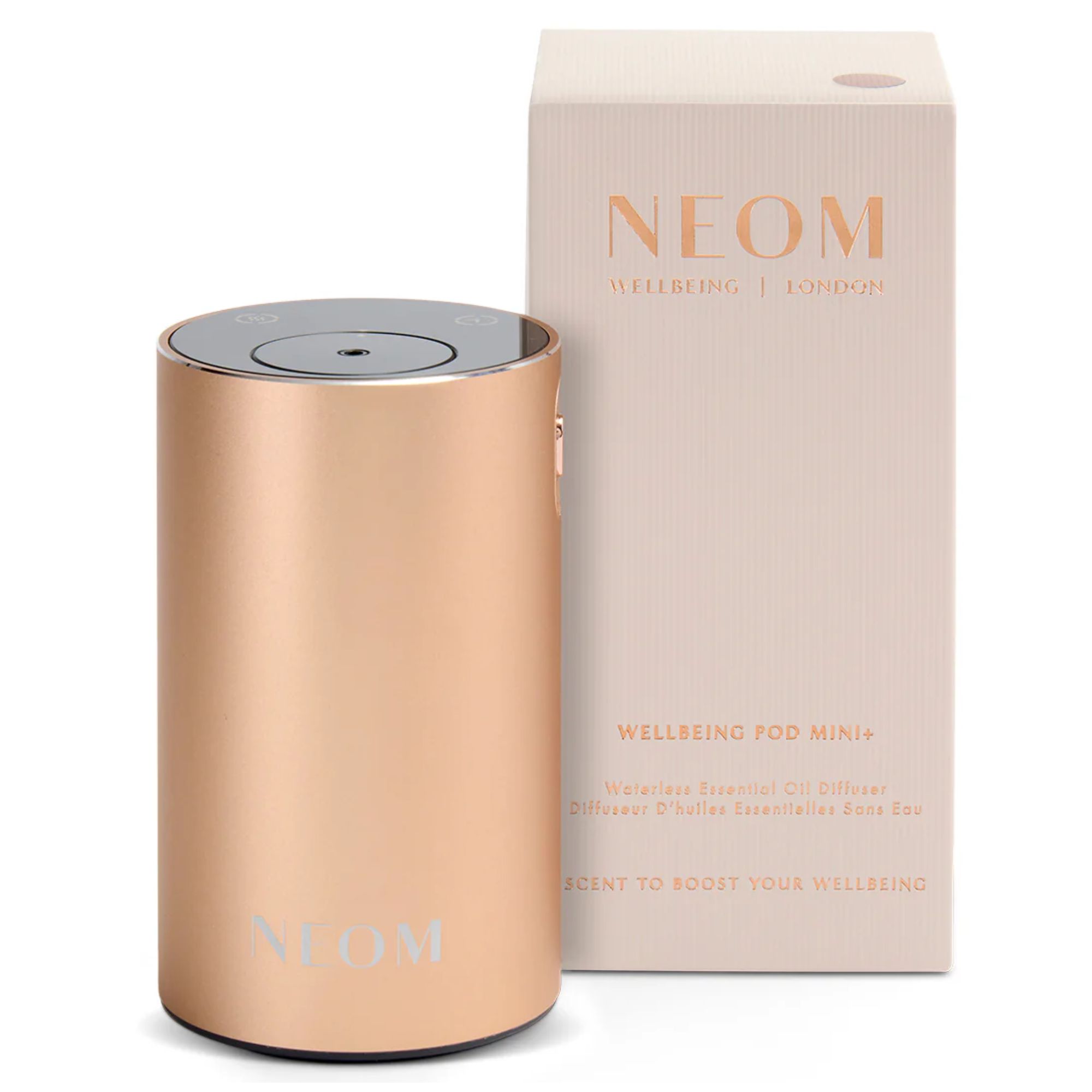 Rose gold NEOM Wellbeing Pod Mini+ with pale pink cardboard packaging