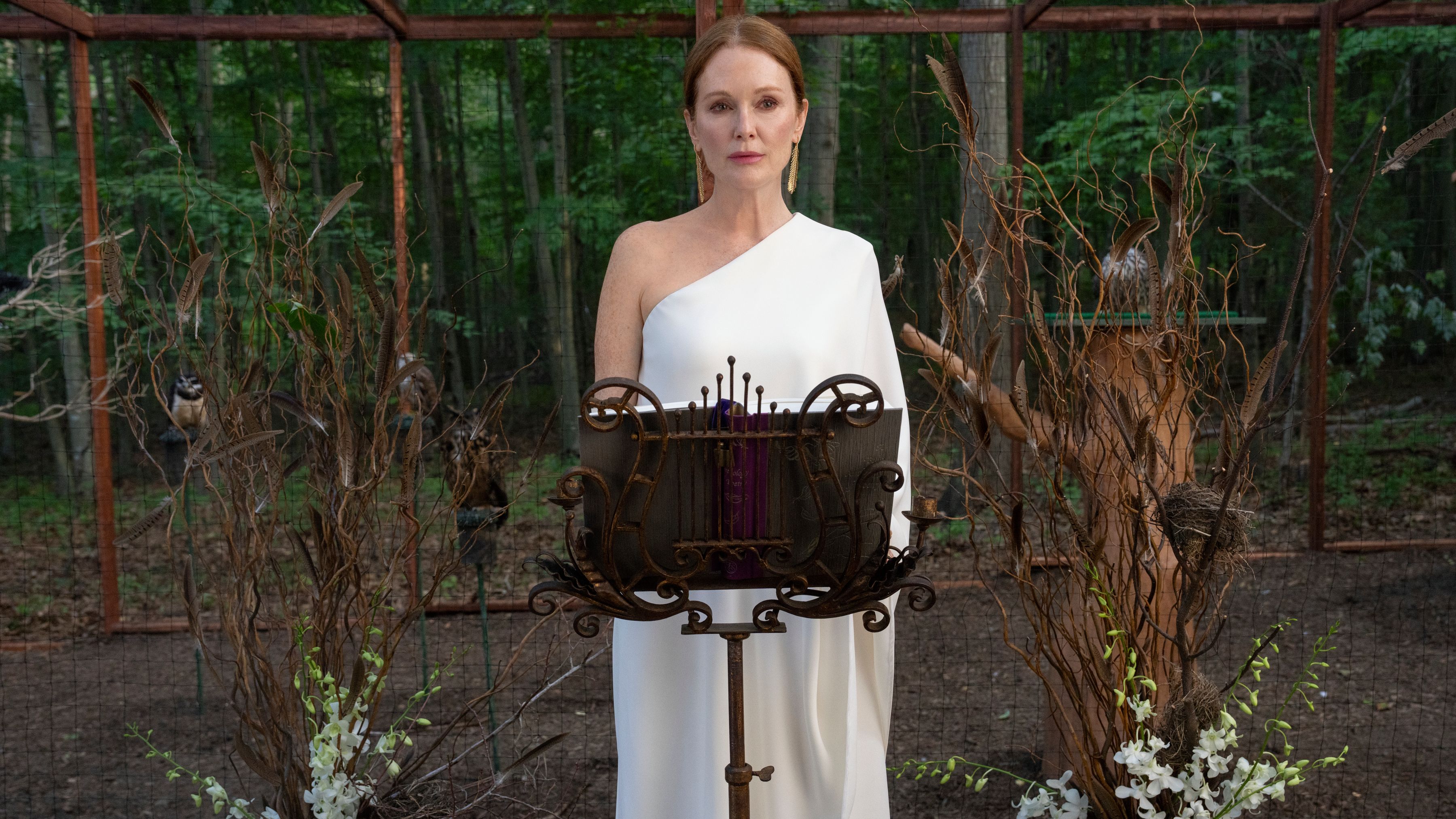 Julianne Moore stands at a podium in a scene from Netflix&#039;s &quot;Sirens&quot;