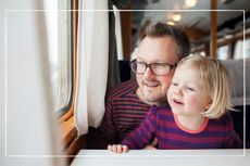 Father and child on a train