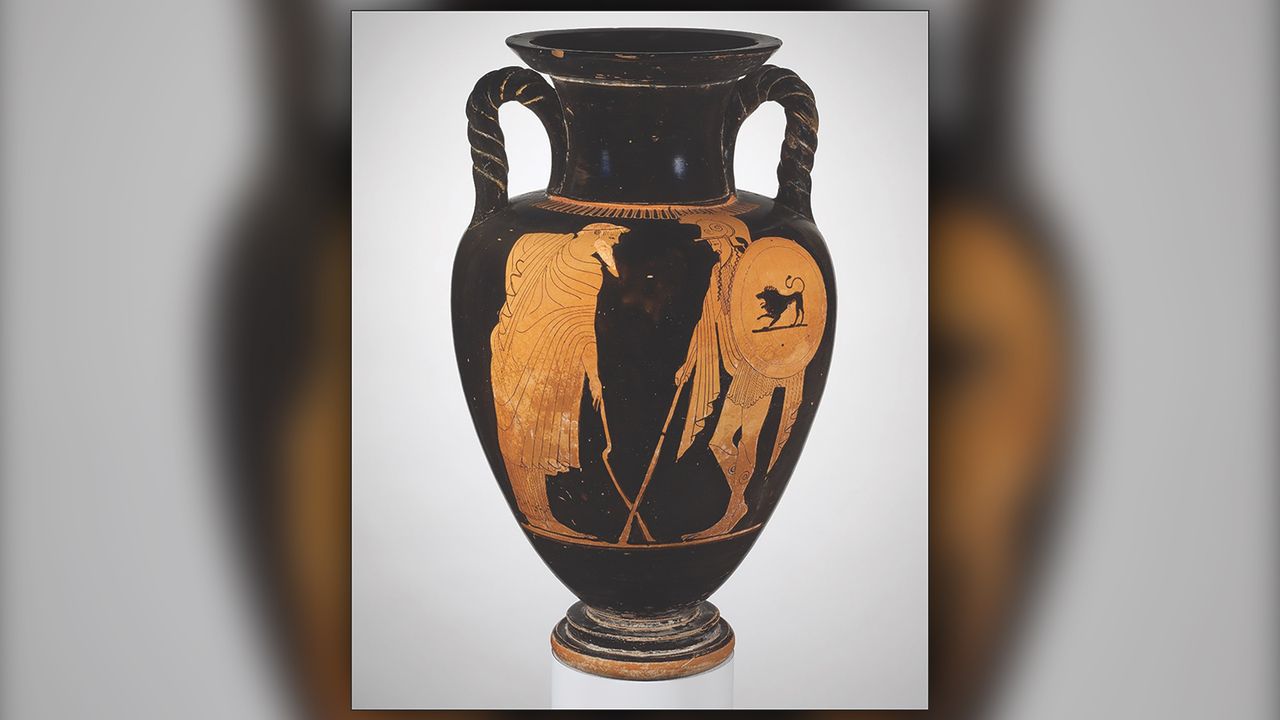 A man leaning on a crooked staff or crutch (left) says goodbye to a warrior on this red-figure amphora, which is attributed to the Matsch Painter, circa. 480 B.C.