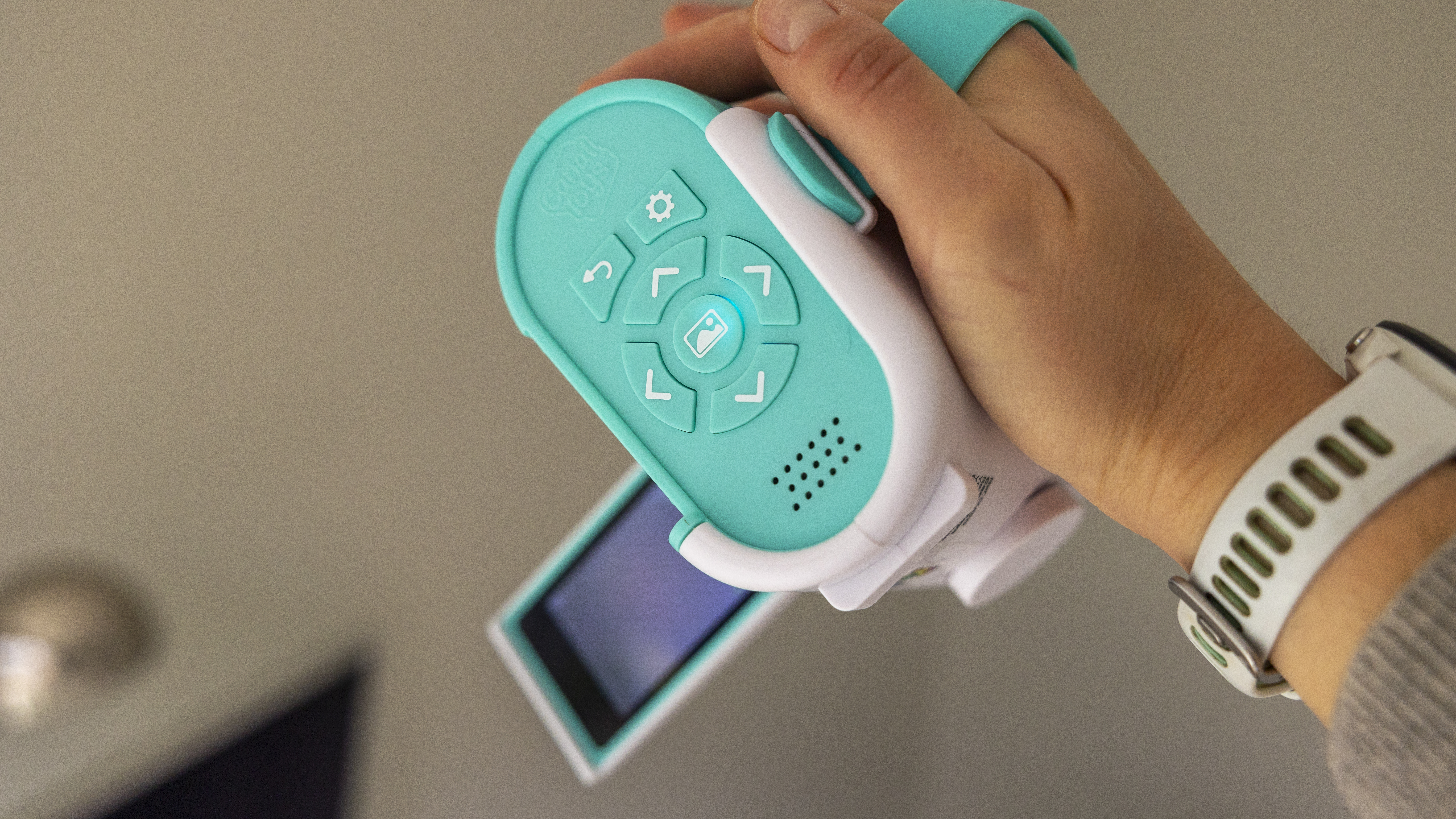 The Photo Creator projector video camera being handled in a home office