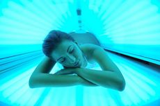 girl inside a tanning bed.