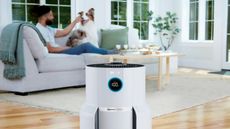 Shark NeverChange Air Purifier MAX in living room with man and dog behind