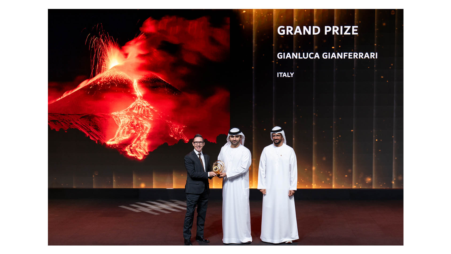Italian photographer Gianluca Gianferrari collects his trophy for winning the grand prize in the 14th season of the Hamdan bin Mohammed bin Rashid Al Maktoum International Photography Award (HIPA)