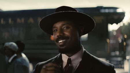 Michael B. Jordan smiling in Sinners.