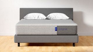 Casper mattress deals: the Casper Original mattress shown on a grey fabric bed frame