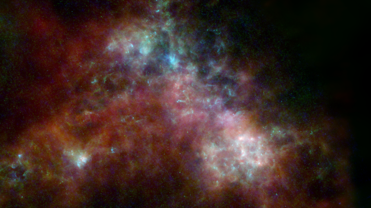 La Pequeña Nube de Magallanes, vecina de la Vía Láctea, vista por la misión Herschel con la ayuda de otros tres telescopios espaciales retirados.