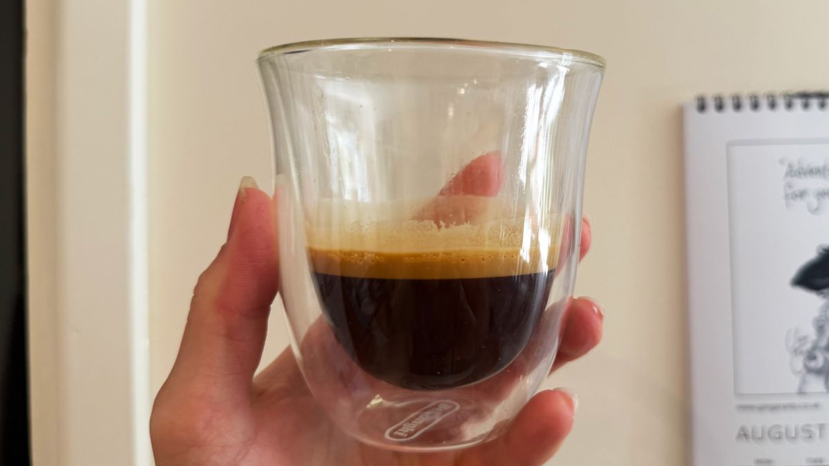 a photograph of an espresso shot pulled on the breville bambino plus in a small glass