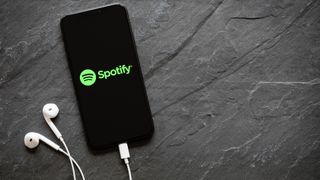 Spotify logo appearing on an Apple iPhone