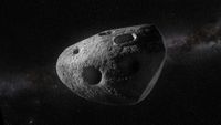An illustration of a slightly triangular asteroid with a few holes in it.