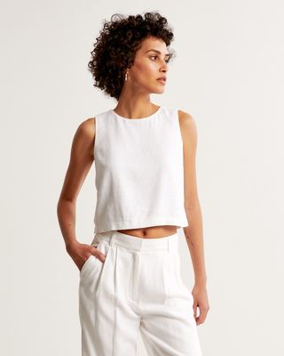 Abercrombie & FItch model in white linen tank and pants