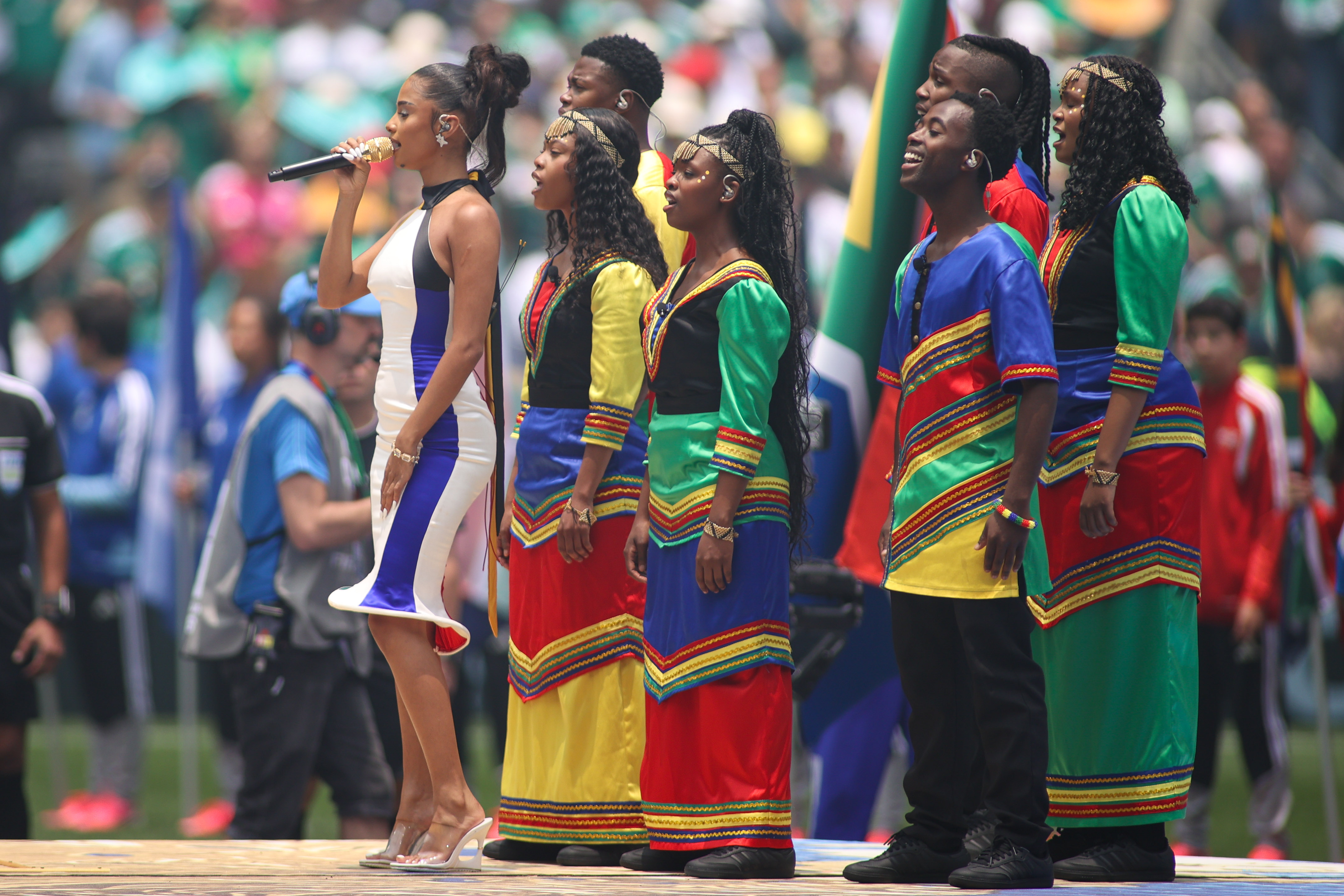 Tyla launches the World Cup in two custom outfits, including a dress inspired by the South African flag