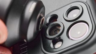 A photo of a ShiftCam LensUltra iPhone lens in black