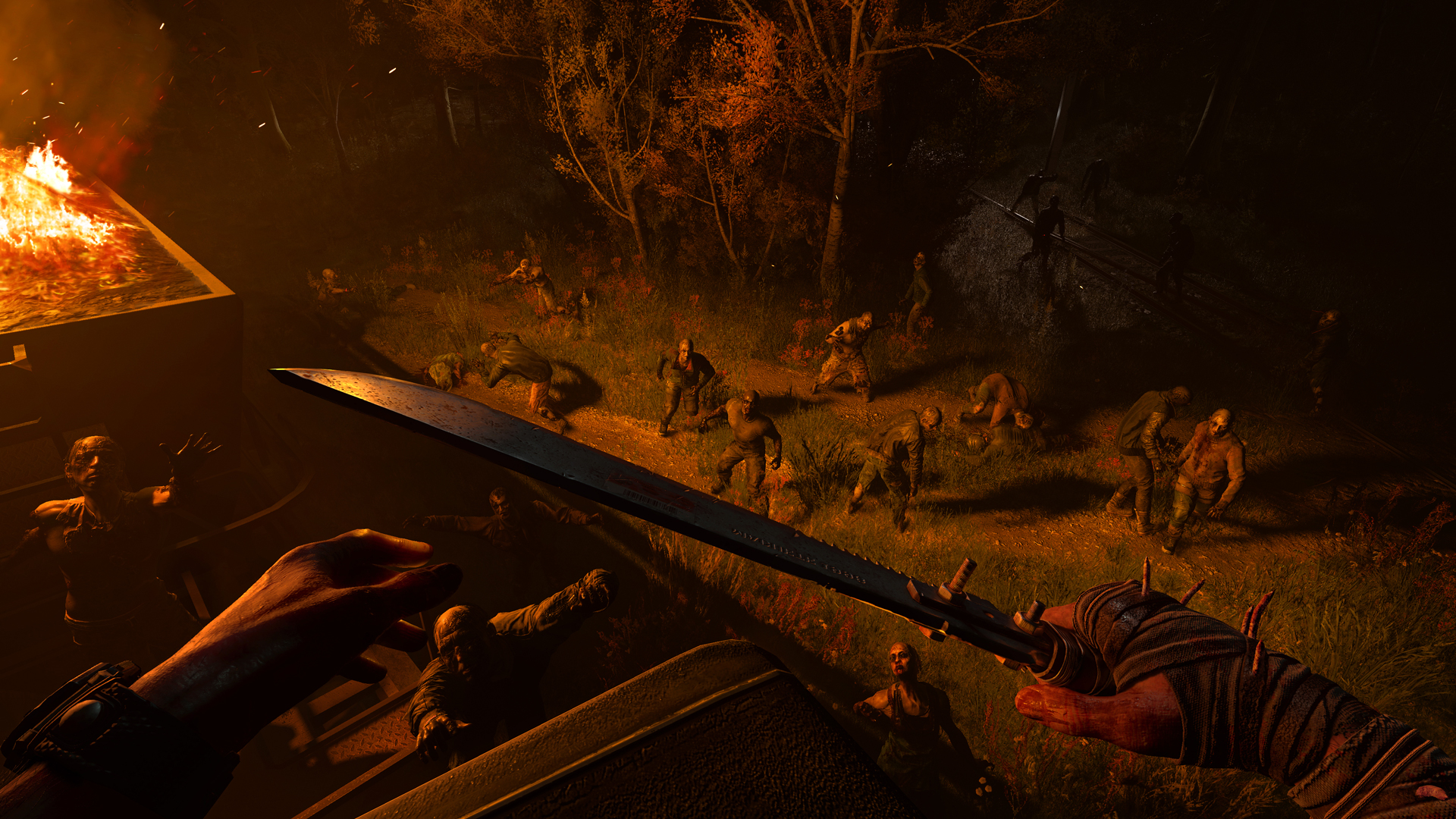 Dying Light: The Beast screenshot of Kyle looking down at a horde of zombies from atop a burning vehicle