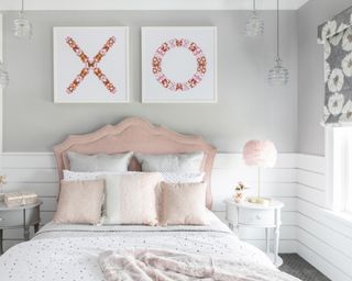 Feminine bedroom in blush and gray palette, with white half wall horizontal wall paneling.