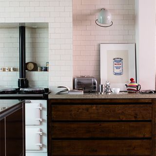 kitchen with white walls and brown cabinet