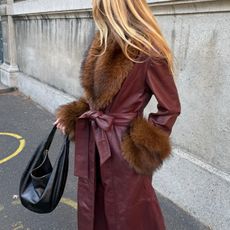 Jeanette Madsen in a burgundy Rotate coat